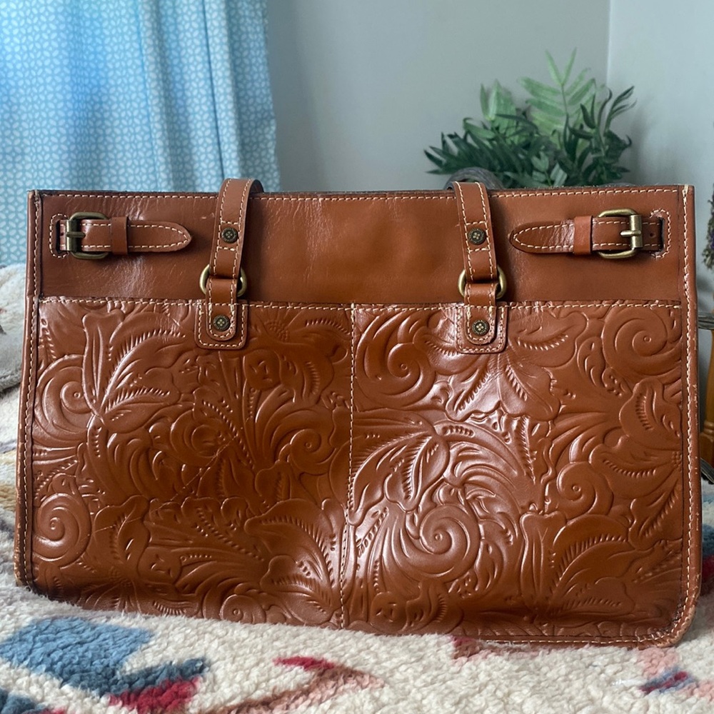 Cognac Patricia Nash purse with some wear and tear